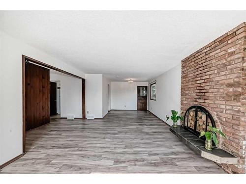 5112 Dalham Crescent Nw, Calgary, AB - Indoor Photo Showing Other Room With Fireplace