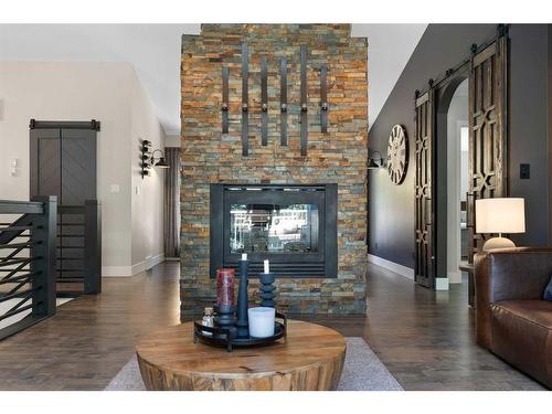 333 Wild Rose Close, Rural Rocky View County, AB - Indoor Photo Showing Living Room With Fireplace