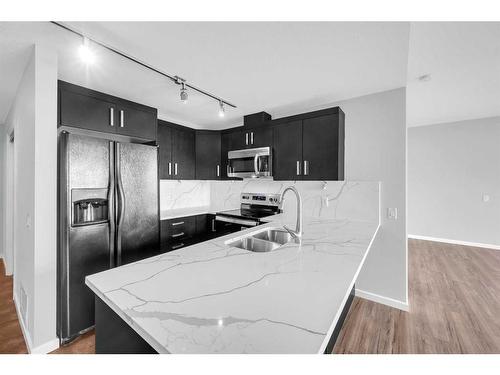 1405-1410 1 Street Se, Calgary, AB - Indoor Photo Showing Kitchen With Double Sink With Upgraded Kitchen