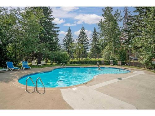 506-3204 Rideau Place Sw, Calgary, AB - Outdoor With In Ground Pool With Backyard