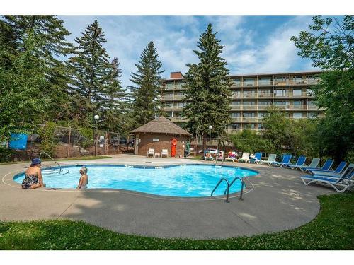 506-3204 Rideau Place Sw, Calgary, AB - Outdoor With In Ground Pool With Backyard