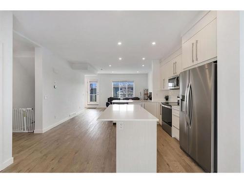 404-669 Savanna Boulevard Ne, Calgary, AB - Indoor Photo Showing Kitchen With Stainless Steel Kitchen With Double Sink With Upgraded Kitchen