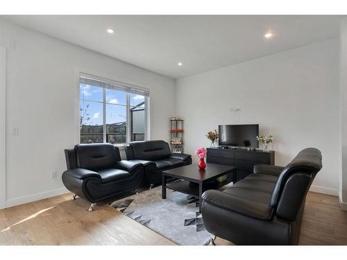 404-669 Savanna Boulevard Ne, Calgary, AB - Indoor Photo Showing Living Room