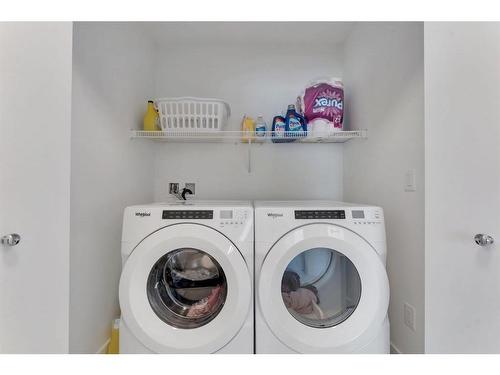 404-669 Savanna Boulevard Ne, Calgary, AB - Indoor Photo Showing Laundry Room