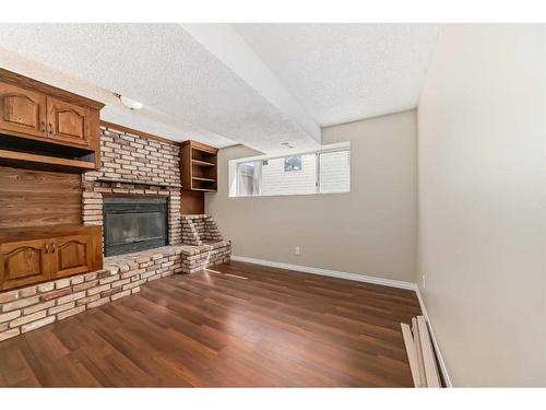 34 Martinbrook Road Ne, Calgary, AB - Indoor With Fireplace