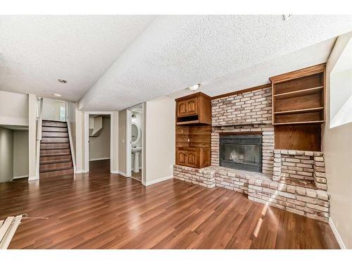 34 Martinbrook Road Ne, Calgary, AB - Indoor Photo Showing Living Room With Fireplace