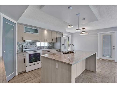 76 Huntmeadow Road Ne, Calgary, AB - Indoor Photo Showing Kitchen With Double Sink