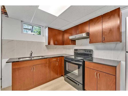 76 Huntmeadow Road Ne, Calgary, AB - Indoor Photo Showing Kitchen With Double Sink