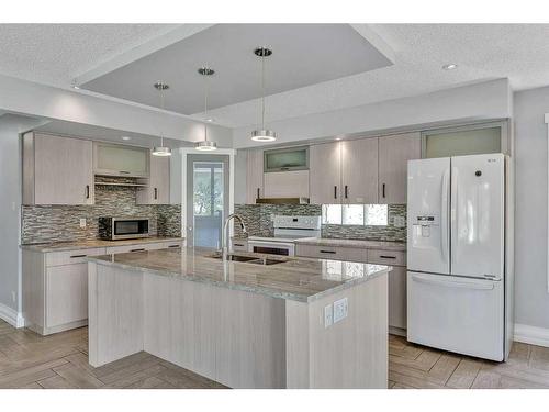 76 Huntmeadow Road Ne, Calgary, AB - Indoor Photo Showing Kitchen With Double Sink With Upgraded Kitchen