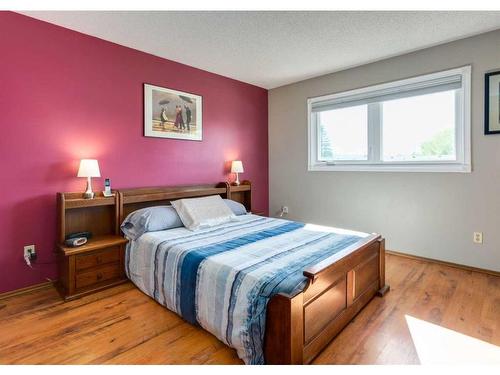 56 Glenwood Place, Cochrane, AB - Indoor Photo Showing Bedroom