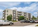 108-5110 36 Street, Red Deer, AB  - Outdoor With Balcony With Facade 