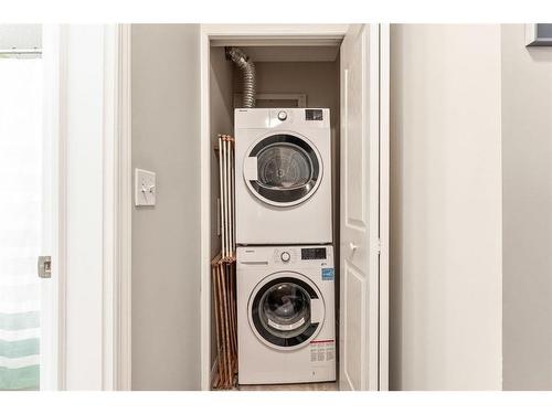 1125-2395 Eversyde Avenue Sw, Calgary, AB - Indoor Photo Showing Laundry Room