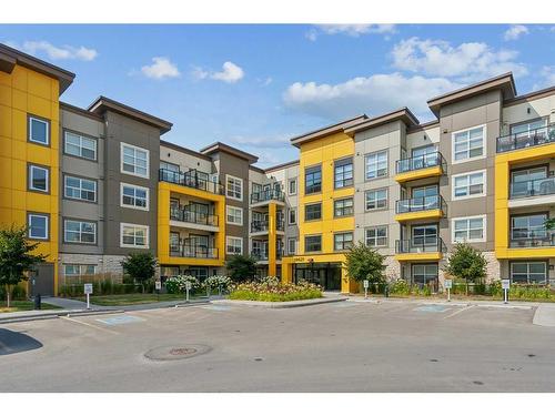 413-19621 40 Street Se, Calgary, AB - Outdoor With Balcony With Facade