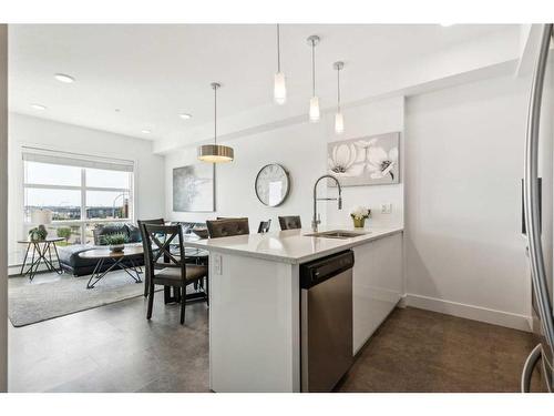 413-19621 40 Street Se, Calgary, AB - Indoor Photo Showing Kitchen With Upgraded Kitchen