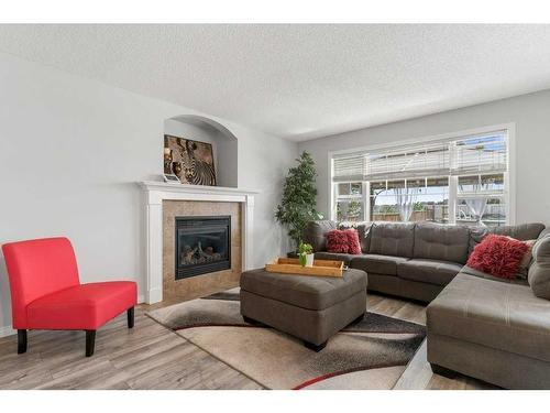 88 Evansford Circle Nw, Calgary, AB - Indoor Photo Showing Living Room With Fireplace