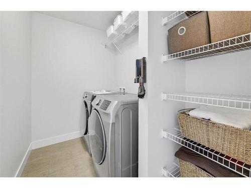 52 Seton Rise Se, Calgary, AB - Indoor Photo Showing Laundry Room