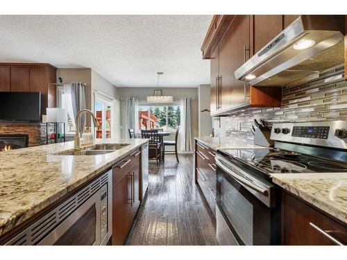 994 Shantz Place, Crossfield, AB - Indoor Photo Showing Kitchen With Stainless Steel Kitchen With Double Sink With Upgraded Kitchen