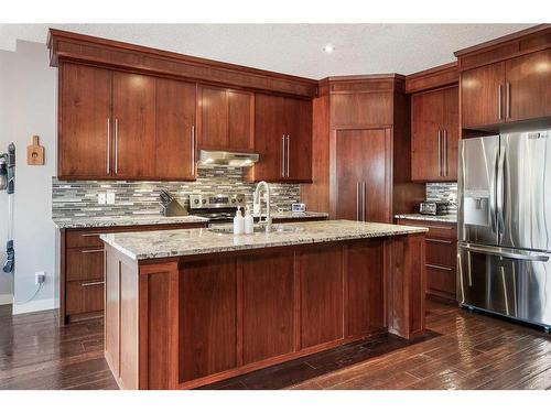 994 Shantz Place, Crossfield, AB - Indoor Photo Showing Kitchen With Stainless Steel Kitchen