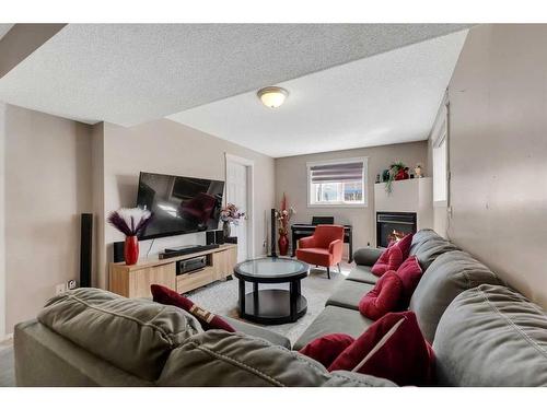 139 Tarington Close Ne, Calgary, AB - Indoor Photo Showing Living Room With Fireplace