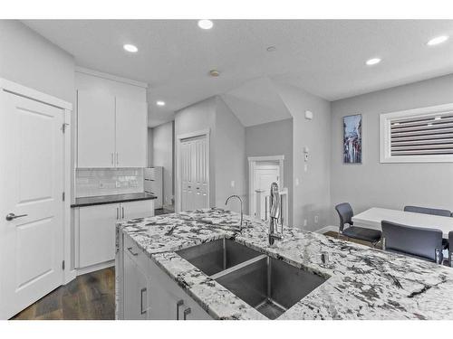 145 Howse Avenue Ne, Calgary, AB - Indoor Photo Showing Kitchen With Double Sink With Upgraded Kitchen