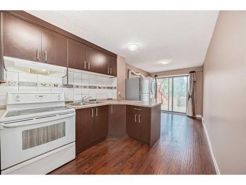 112 Falwood Crescent Ne, Calgary, AB - Indoor Photo Showing Kitchen With Double Sink