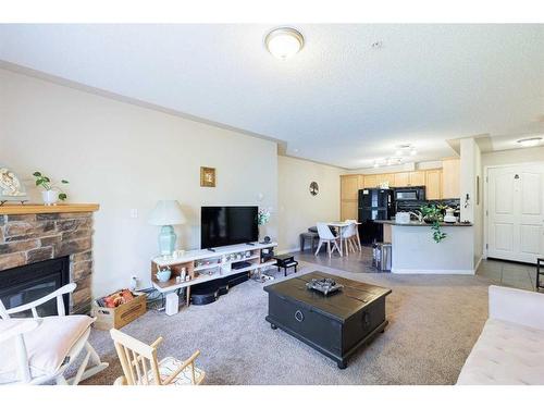 313-369 Rocky Vista Park Nw, Calgary, AB - Indoor Photo Showing Living Room With Fireplace