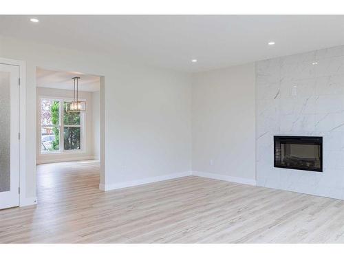 255 Panorama Hills Manor Nw, Calgary, AB - Indoor Photo Showing Living Room With Fireplace