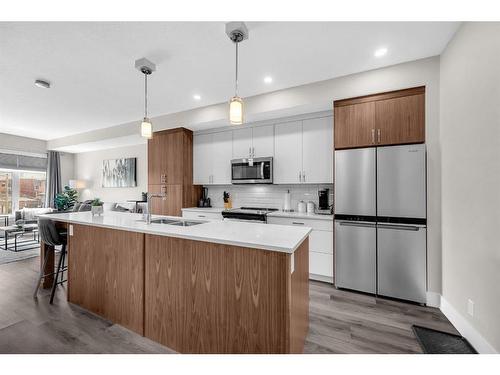 #305-1702 17 Avenue Sw, Calgary, AB - Indoor Photo Showing Kitchen With Stainless Steel Kitchen With Double Sink With Upgraded Kitchen