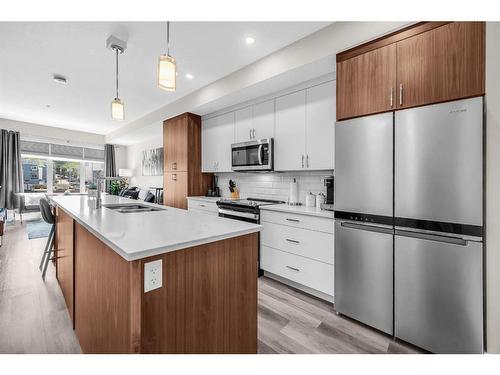 #305-1702 17 Avenue Sw, Calgary, AB - Indoor Photo Showing Kitchen With Stainless Steel Kitchen With Upgraded Kitchen