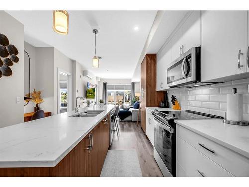 #305-1702 17 Avenue Sw, Calgary, AB - Indoor Photo Showing Kitchen With Double Sink