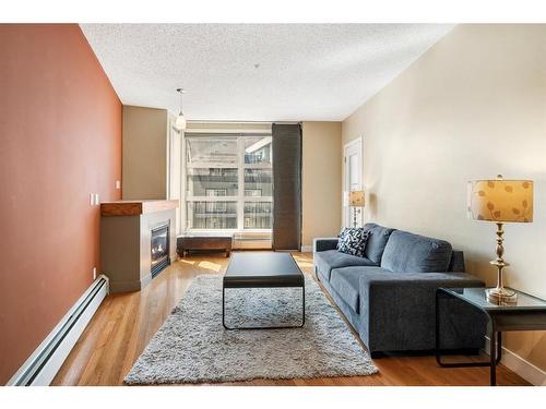 315-315 24 Avenue Sw, Calgary, AB - Indoor Photo Showing Living Room With Fireplace