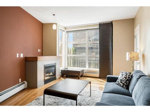 315-315 24 Avenue Sw, Calgary, AB - Indoor Photo Showing Living Room With Fireplace