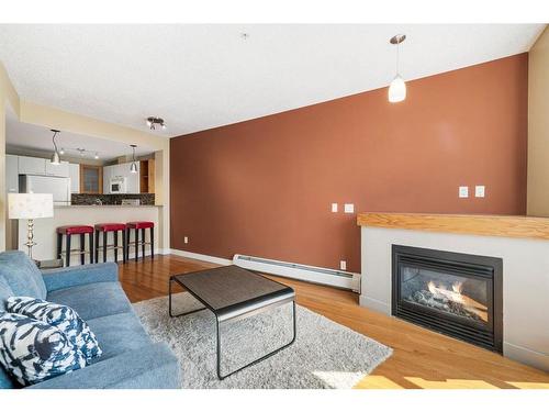 315-315 24 Avenue Sw, Calgary, AB - Indoor Photo Showing Living Room With Fireplace