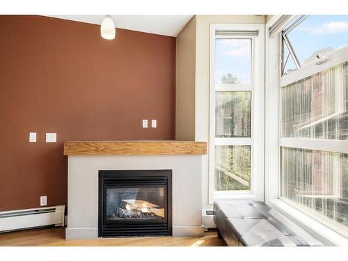 315-315 24 Avenue Sw, Calgary, AB - Indoor Photo Showing Living Room With Fireplace