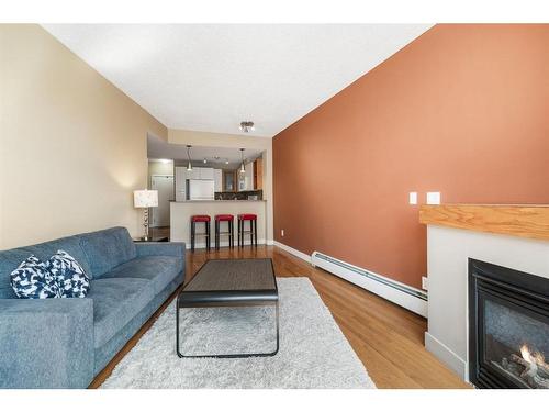 315-315 24 Avenue Sw, Calgary, AB - Indoor Photo Showing Living Room With Fireplace