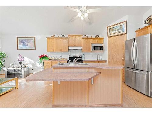 8 Bridleridge Road Sw, Calgary, AB - Indoor Photo Showing Kitchen With Double Sink