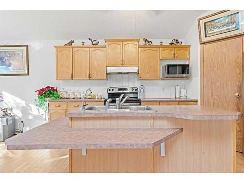 8 Bridleridge Road Sw, Calgary, AB - Indoor Photo Showing Kitchen With Double Sink