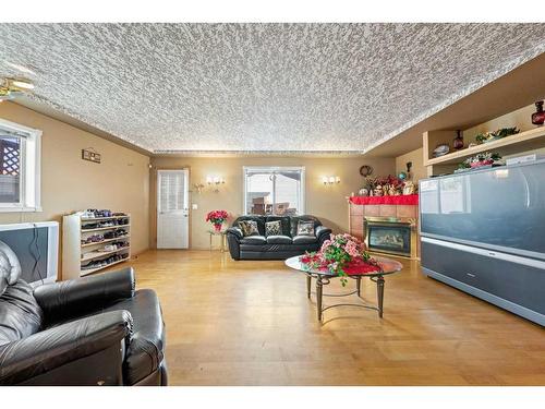 8 Bridleridge Road Sw, Calgary, AB - Indoor Photo Showing Living Room With Fireplace