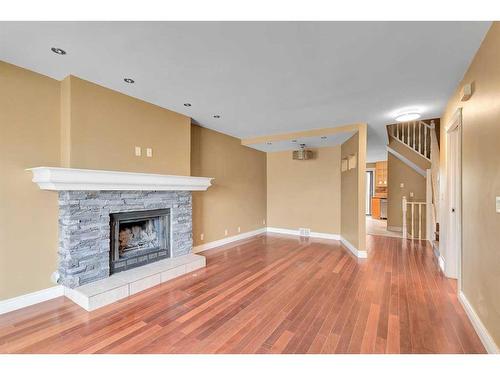 144 Macewan Glen Close Nw, Calgary, AB - Indoor With Fireplace