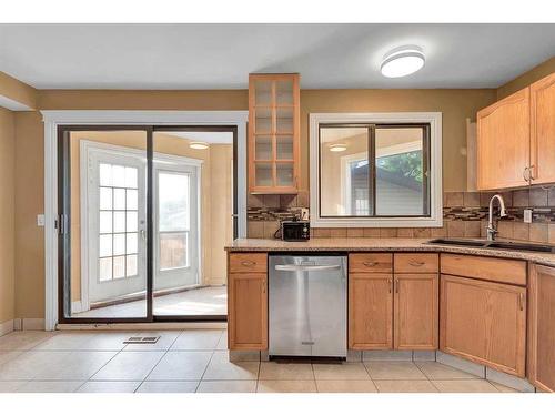 144 Macewan Glen Close Nw, Calgary, AB - Indoor Photo Showing Kitchen With Double Sink