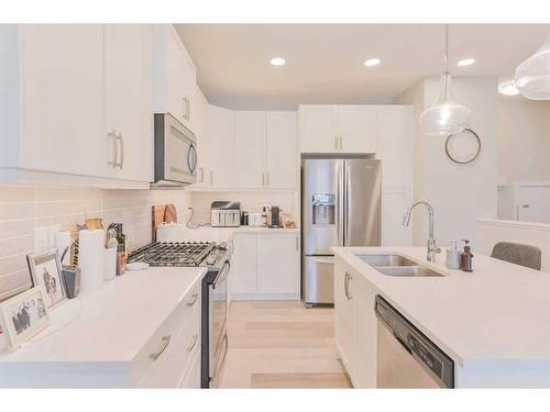 31 Crestbrook Drive Sw, Calgary, AB - Indoor Photo Showing Kitchen With Double Sink With Upgraded Kitchen