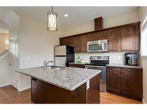 242 Cranford Way Se, Calgary, AB - Indoor Photo Showing Kitchen With Double Sink