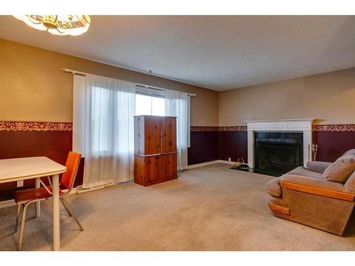 611 Agate Crescent Se, Calgary, AB - Indoor With Fireplace