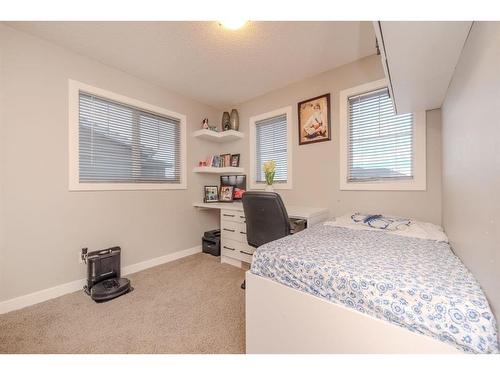 124 Westcreek Green, Chestermere, AB - Indoor Photo Showing Bedroom