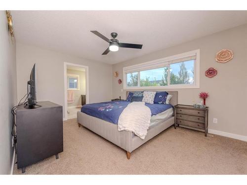 124 Westcreek Green, Chestermere, AB - Indoor Photo Showing Bedroom