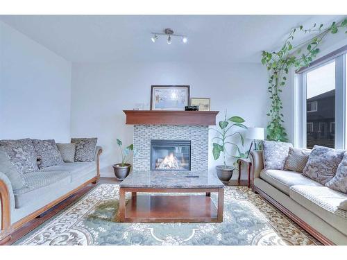 21 Saddlelake Gardens Ne, Calgary, AB - Indoor Photo Showing Living Room With Fireplace