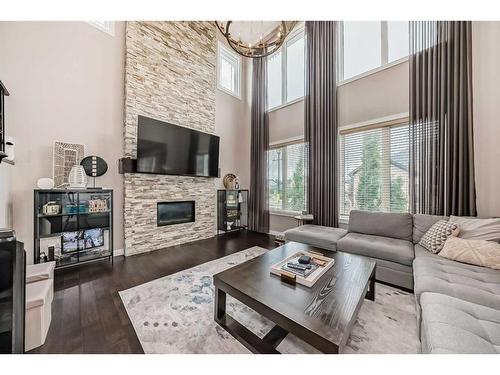 284 Aspenmere Circle, Chestermere, AB - Indoor Photo Showing Living Room With Fireplace