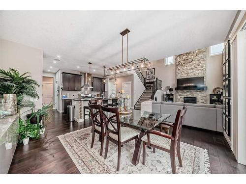 284 Aspenmere Circle, Chestermere, AB - Indoor Photo Showing Dining Room With Fireplace