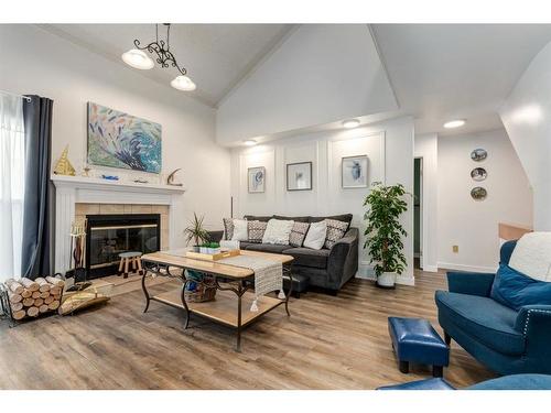 127 Woodfield Road Sw, Calgary, AB - Indoor Photo Showing Living Room With Fireplace