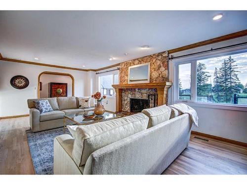 33 Cullen Creek Estates, Rural Rocky View County, AB - Indoor Photo Showing Living Room With Fireplace